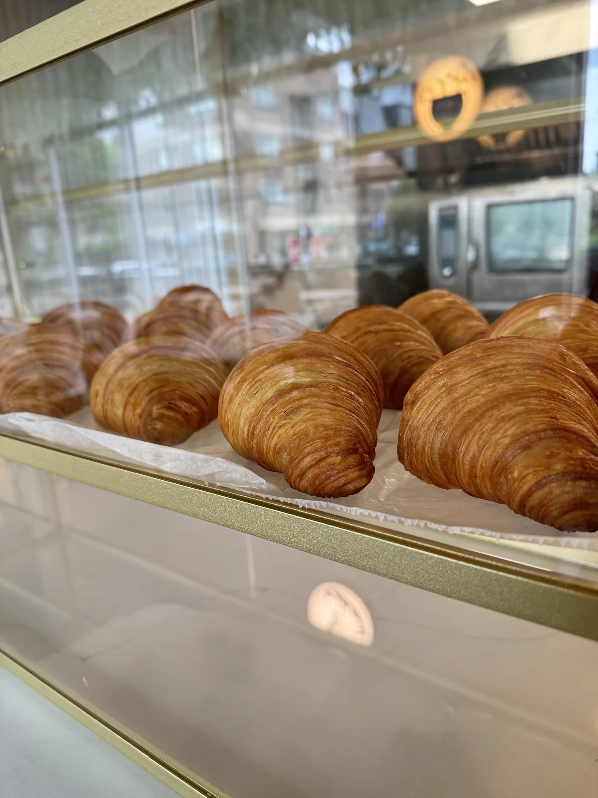 Croissants and pastries in the display case at The Cake Pantry in Fishers